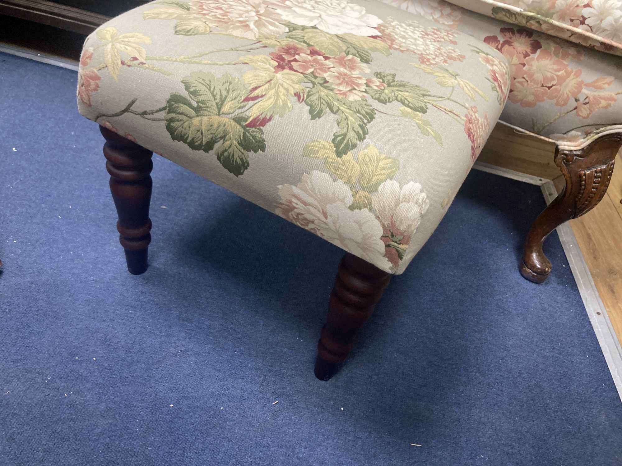 A French Hepplewhite style wing armchair together with a matching contemporary footstool